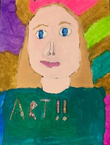 blonde girl's self-portrait with a rainbow background, green shirt, and the word "art" with two exclamation points